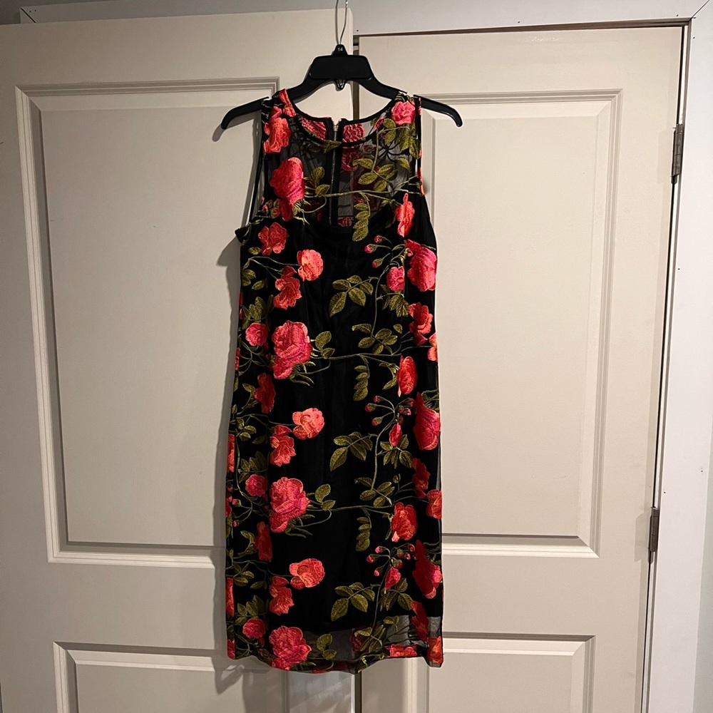 Beautiful black and coral tone sleeveless dress. Great for any occasion.